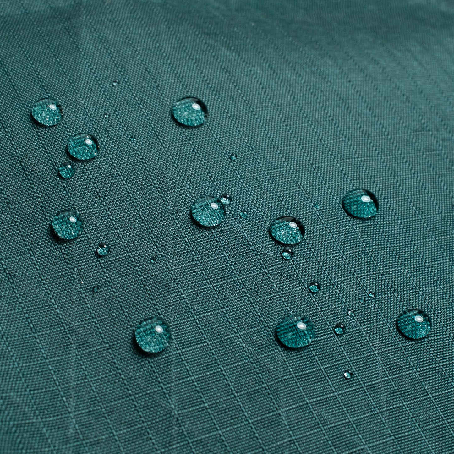 General shot of Topo Designs Global Pro Travel Tote showing water droplets on waterproof fabric