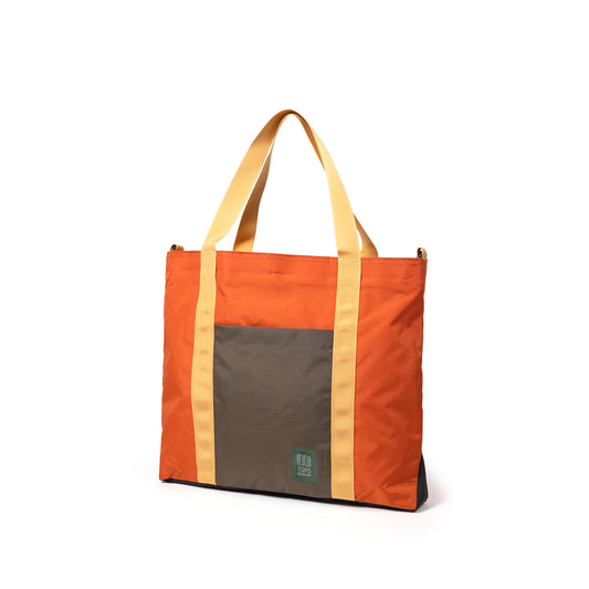 Quarter View of Topo Designs Mountain Essential Tote in "Woodland / Terracotta"