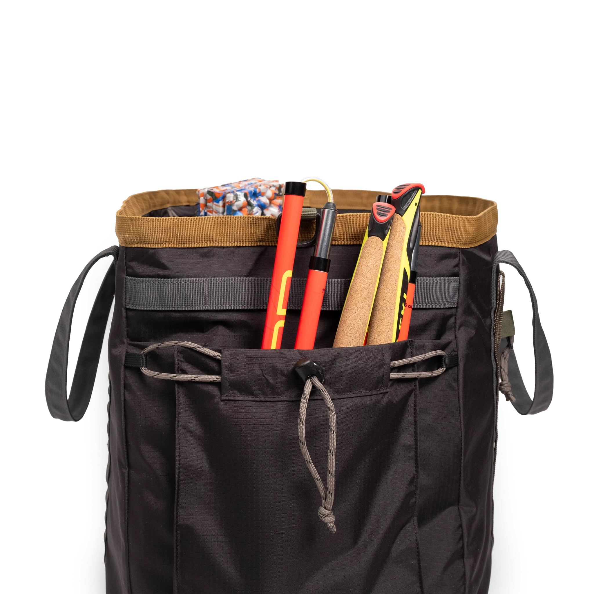General detail shot of Topo Designs Mountain Gear Bag in "Black / Neutral" with side pocket packed out.