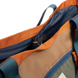 General detail shot of Topo Designs Mountain Utility Tote compartment toggle in "Olive / Dark Khaki".