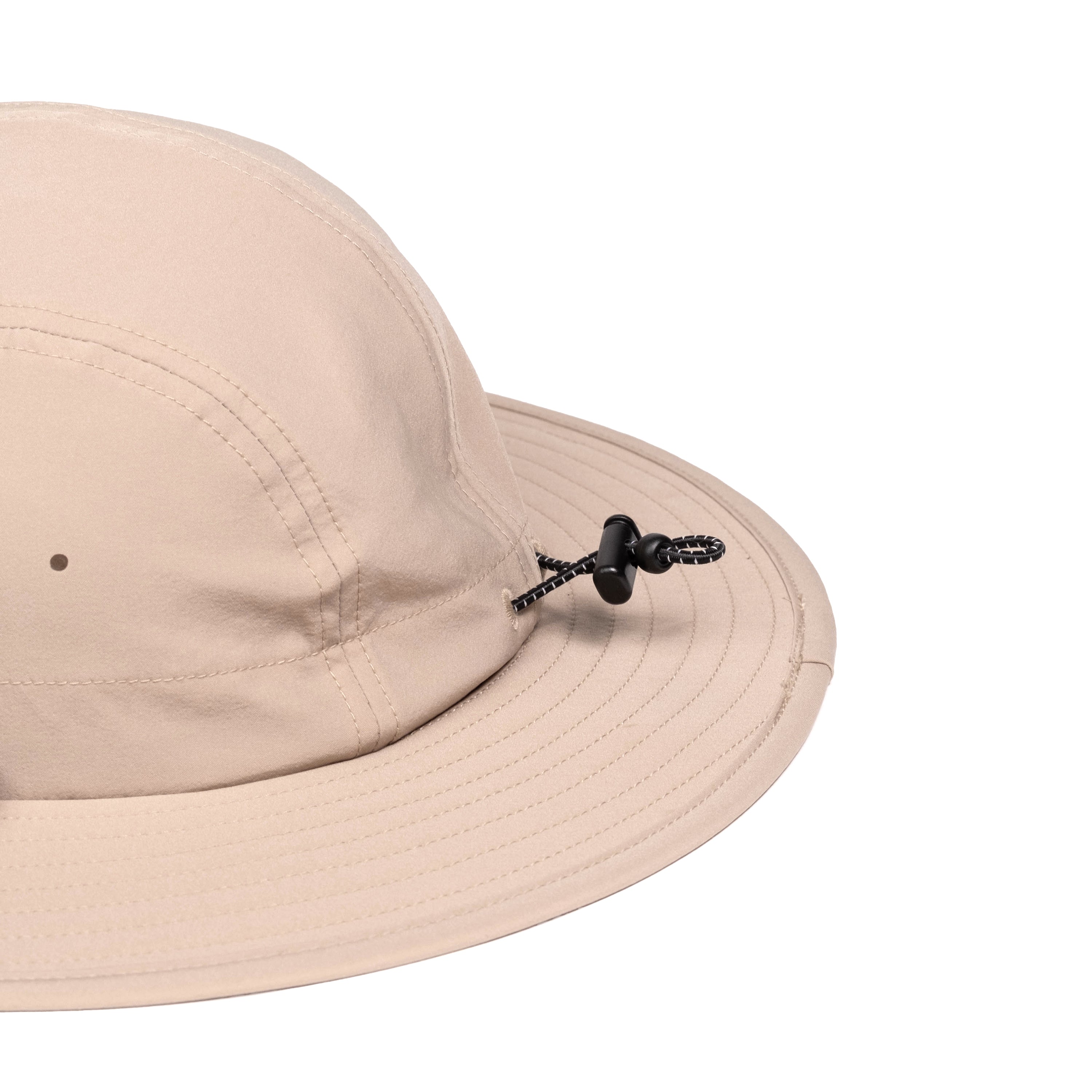 General detail shot of Topo Designs Sun Hat with original logo patch in "Cobblestone".