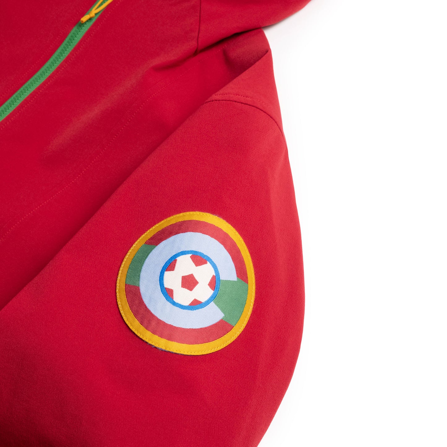Sleeve detail view of Topo Designs x Colorado Rapids HighPeak Jacket in "Rio Red / Midnight"