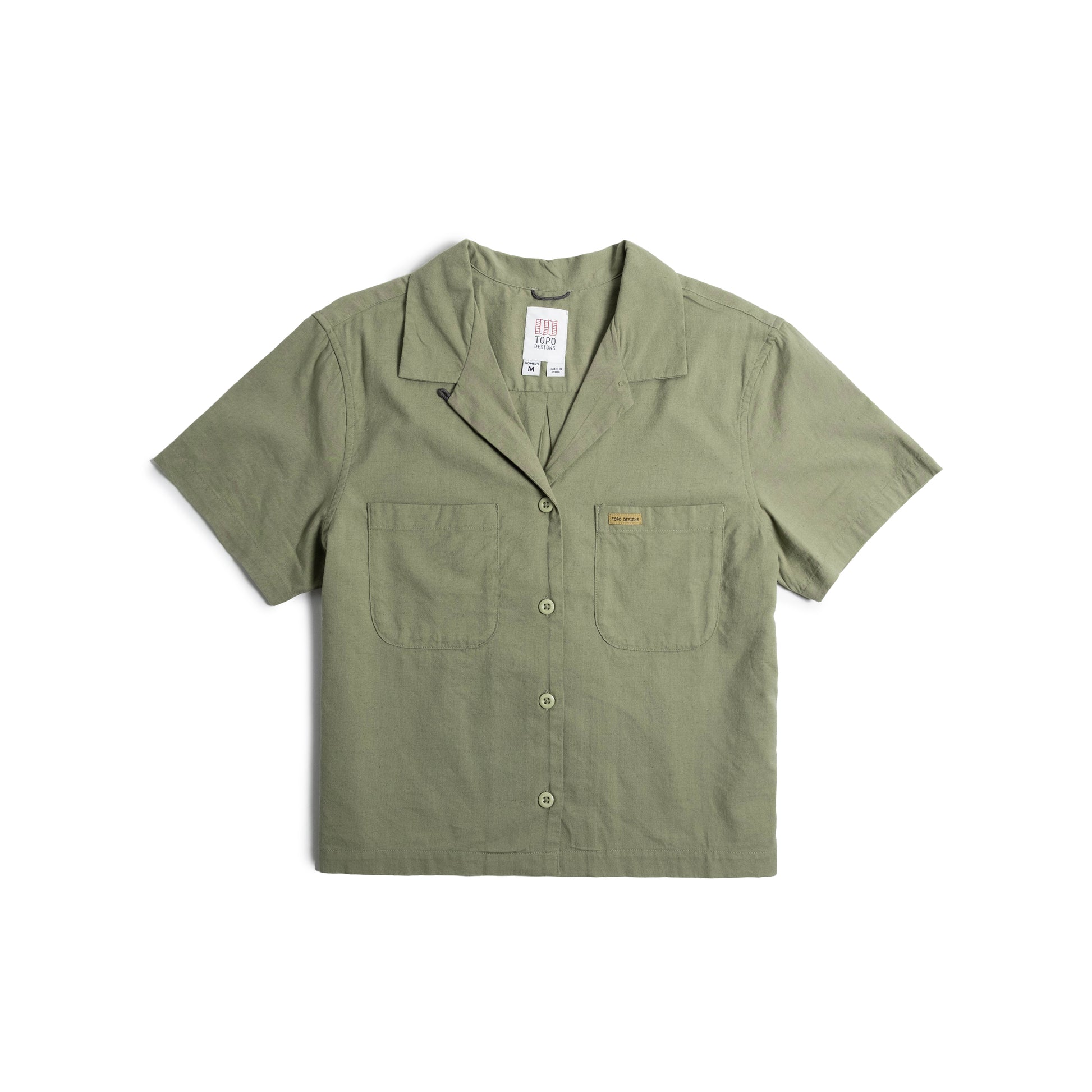Front flat lay image on white background of Topo Designs Daytripper Short Sleeve Shirt - Women's in "Oil Green"