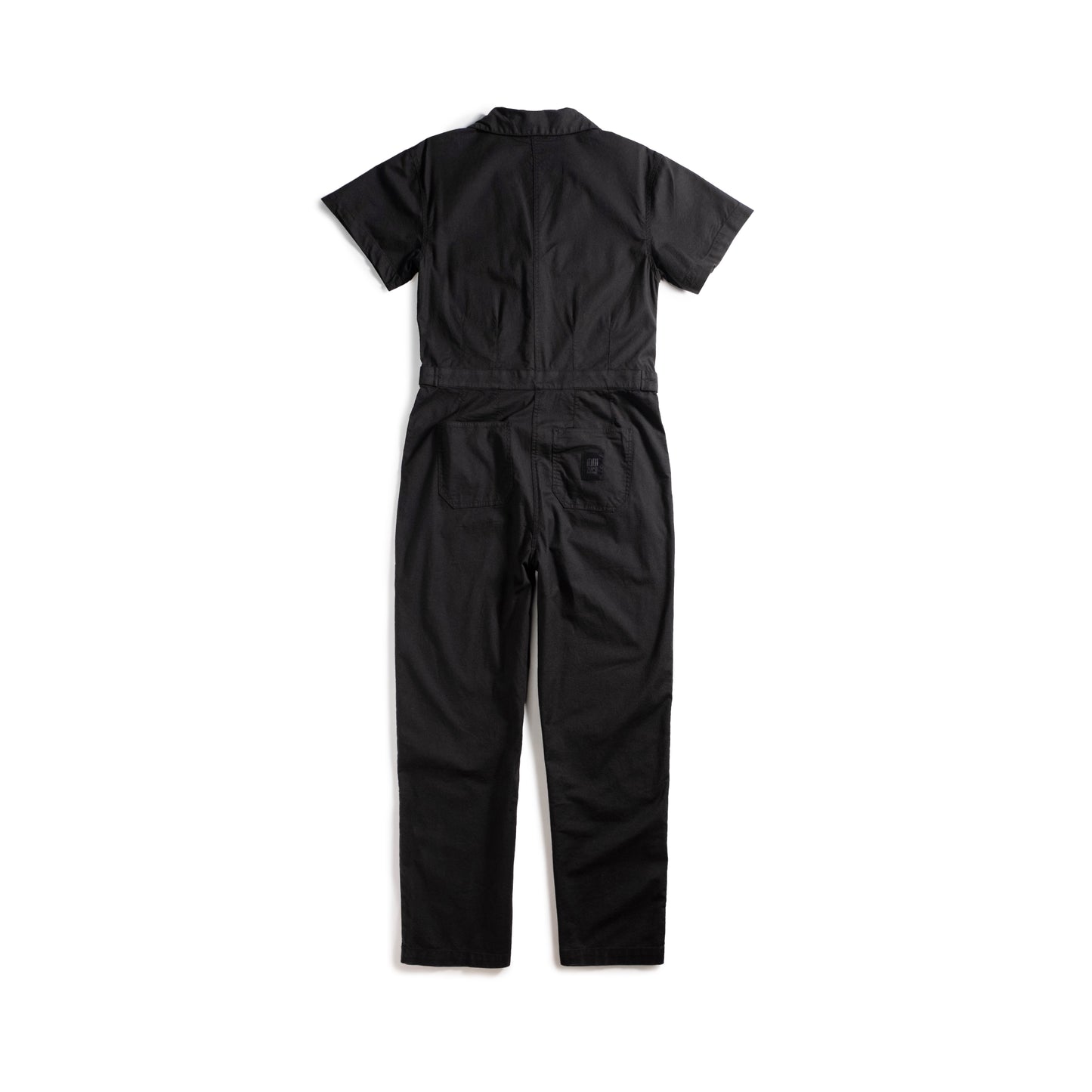 Back white background flat lay image of Topo Designs Desert Coverall - Women's in "Black"