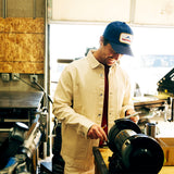 General lifestyle image of Patch Mesh Trucker - Retro Icon hat in "French Blue"
