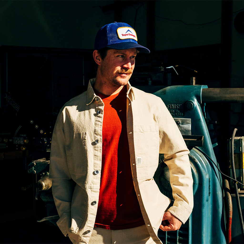 General lifestyle image of Patch Mesh Trucker - Retro Icon hat in "French Blue"