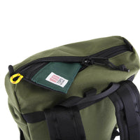 General top detail shot of Topo Designs Y-Pack in olive green showing zipper pocket on top flap