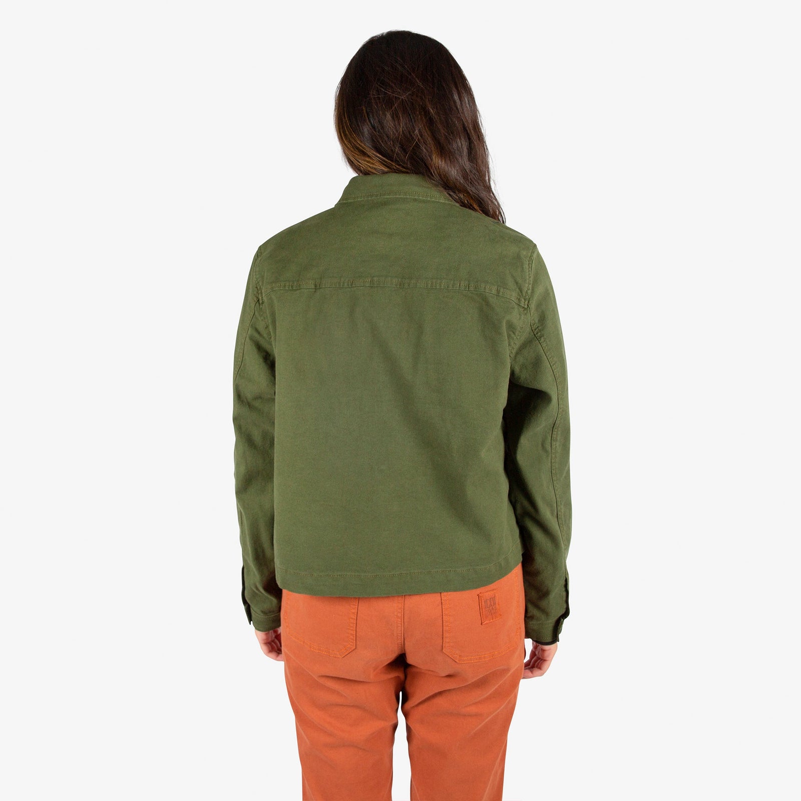 Back model shot of Topo Designs Women's Dirt Jacket in "Olive" green & Dirt Pants in Brick orange.