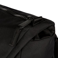 Detail Shot of the Topo Designs Rover Pack Premium showing the zipper on the top flap of the bag in "Premium Black".