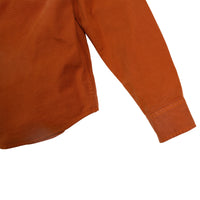 General detail shot of Topo Designs Men's Dirt Shirt in Brick orange showing sleeve cuff.
