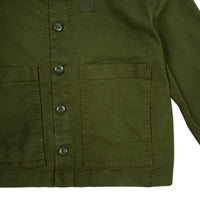 General detail shot of Topo Designs Women's Dirt Jacket in Olive green showing front pockets and buttons.
