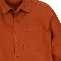 General detail shot of Topo Designs Men's Dirt Shirt in Brick orange showing buttons and chest pocket.