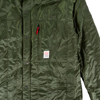 General inside detail shot of Men's Topo Designs Insulated Shirt Jacket in Olive green showing lining.