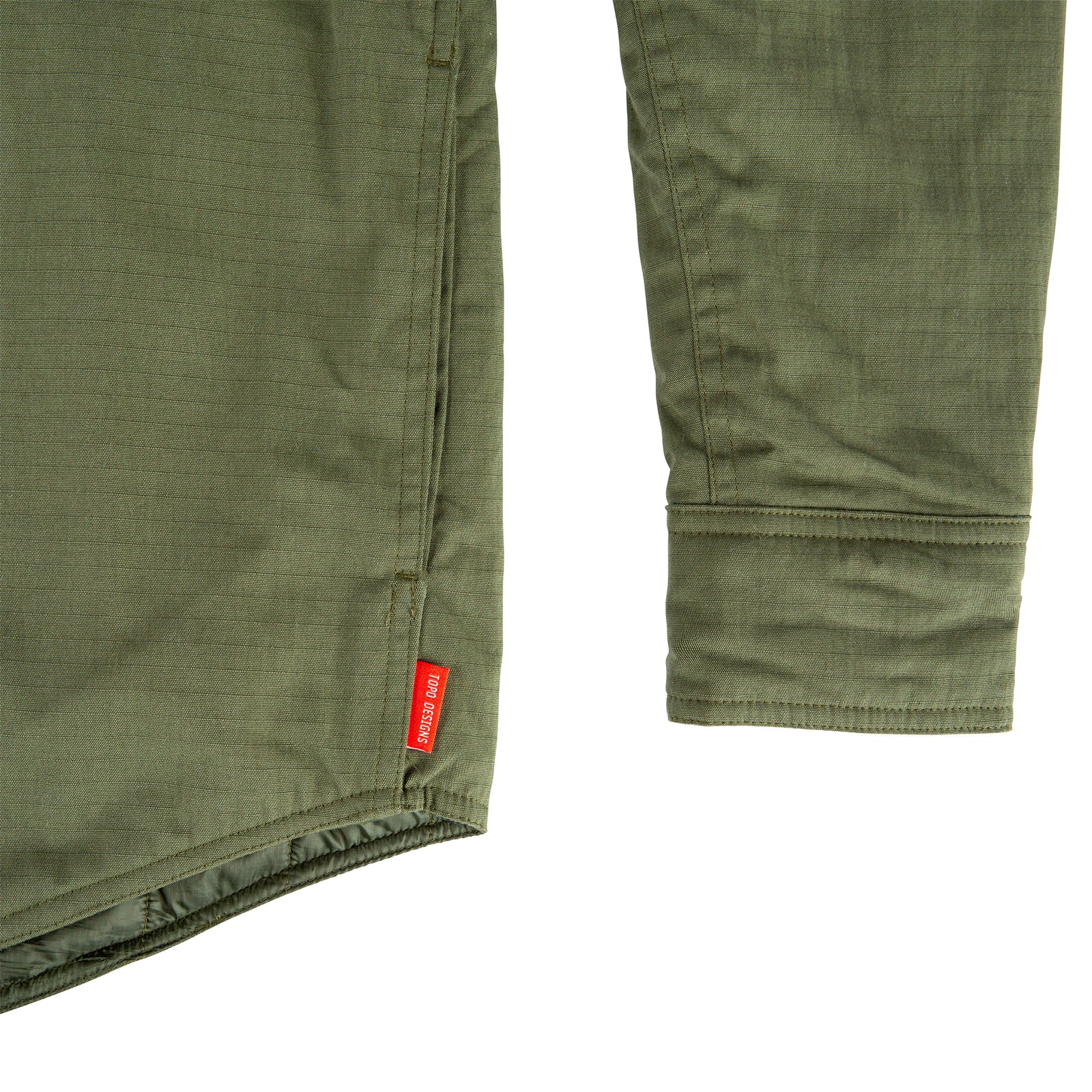 General detail shot of Men's Topo Designs Insulated Shirt Jacket in Olive green showing sleeve cuff.