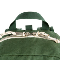 General detail shot of Topo Designs Light Pack handle and zippers in Forest canvas. showing zipper pull tabs.