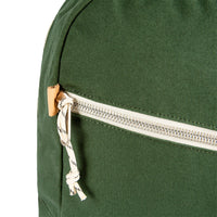 General detail shot of Topo Designs Light Pack in Forest canvas showing zipper pull tabs.