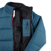 General detail shot of internal chest zipper pocket on Topo Designs Men's Puffer recycled insulated Jacket in "Pond Blue"