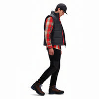 Side model shot of Topo Designs Men's Mountain Puffer recycled insulated Vest in "Black".