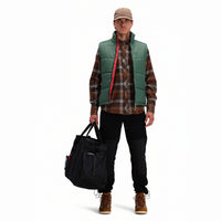 Front model shot of Topo Designs Men's Mountain Puffer recycled insulated Vest in "Forest" green.