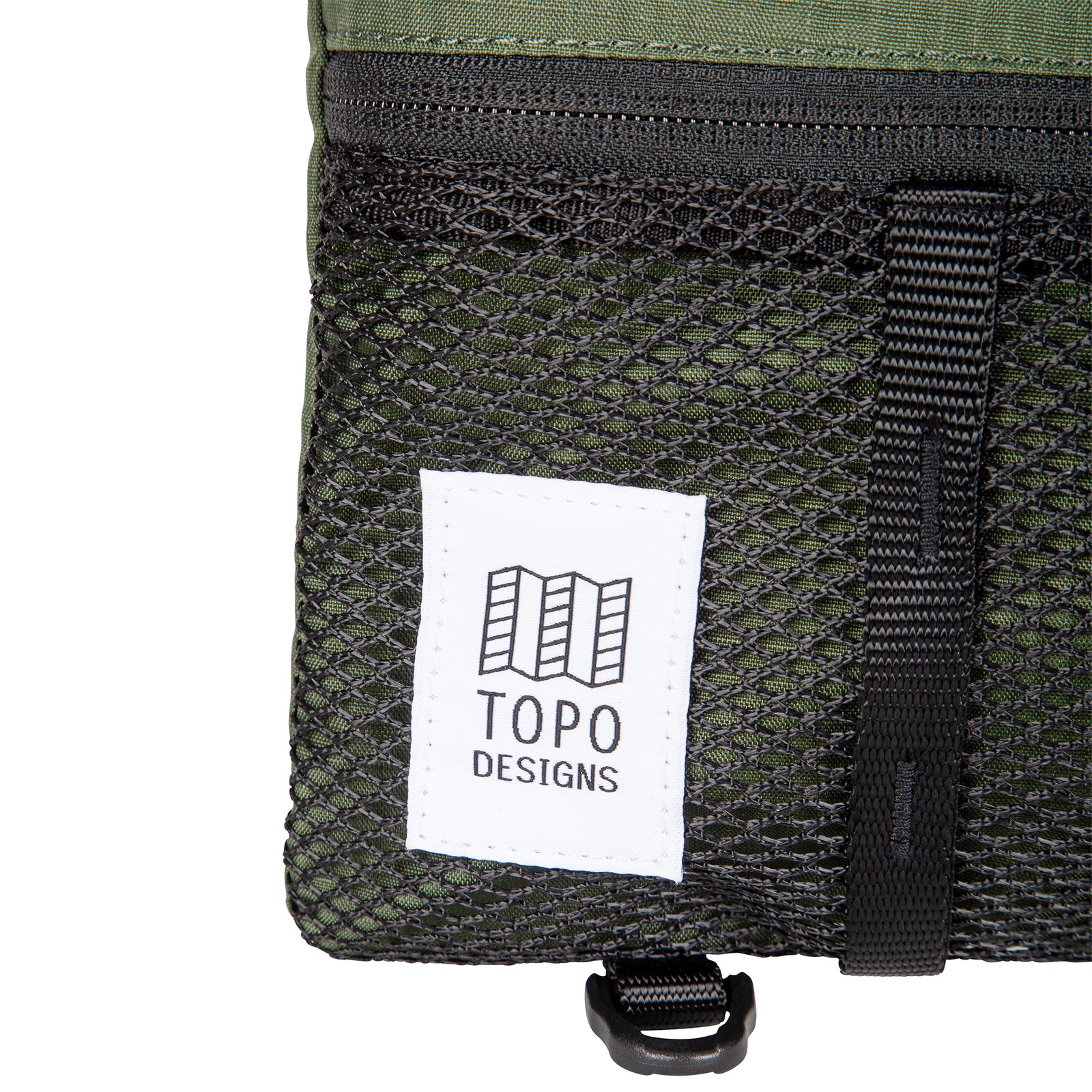 General shot of Topo Designs Mountain Accessory crossbody Shoulder Bag in olive green showing label up close.