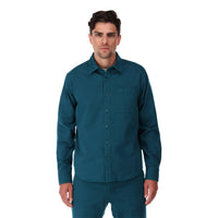 Topo Designs Men's Dirt Shirt long sleeve organic cotton button-up in "pond blue" on model front.