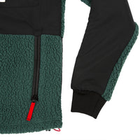 General detail product shot of the men's subalpine fleece in black/forest showing sleeve detailing.