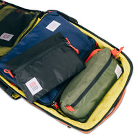 General shot of Pack Bag, Dopp Kit, & Accessory Bag inside Topo Designs Global Travel Bag 30L Durable Carry On Convertible Laptop Travel Backpack.