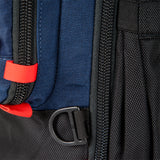 General shot of Topo Designs Global Travel Bag 30L Durable Carry On Convertible Laptop Travel Backpack in Navy blue showing attachment points and locking zippers.