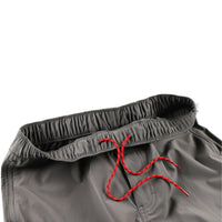 General shot of Topo Designs Men's Boulder lightweight climbing & hiking pants in Charcoal gray showing red drawstring in elastic waist band.