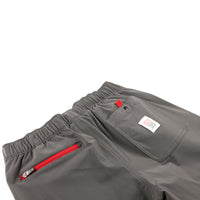 General shot of Topo Designs Men's Boulder lightweight climbing & hiking pants in Charcoal gray showing back zipper and snap pockets.
