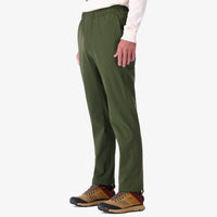 Shot of Topo Designs Men's Boulder lightweight climbing & hiking pants in "Olive" green on model.