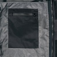 General shot of internal chest zipper pocket on Topo Designs Men's Mountain Parka waterproof shell jacket in black.