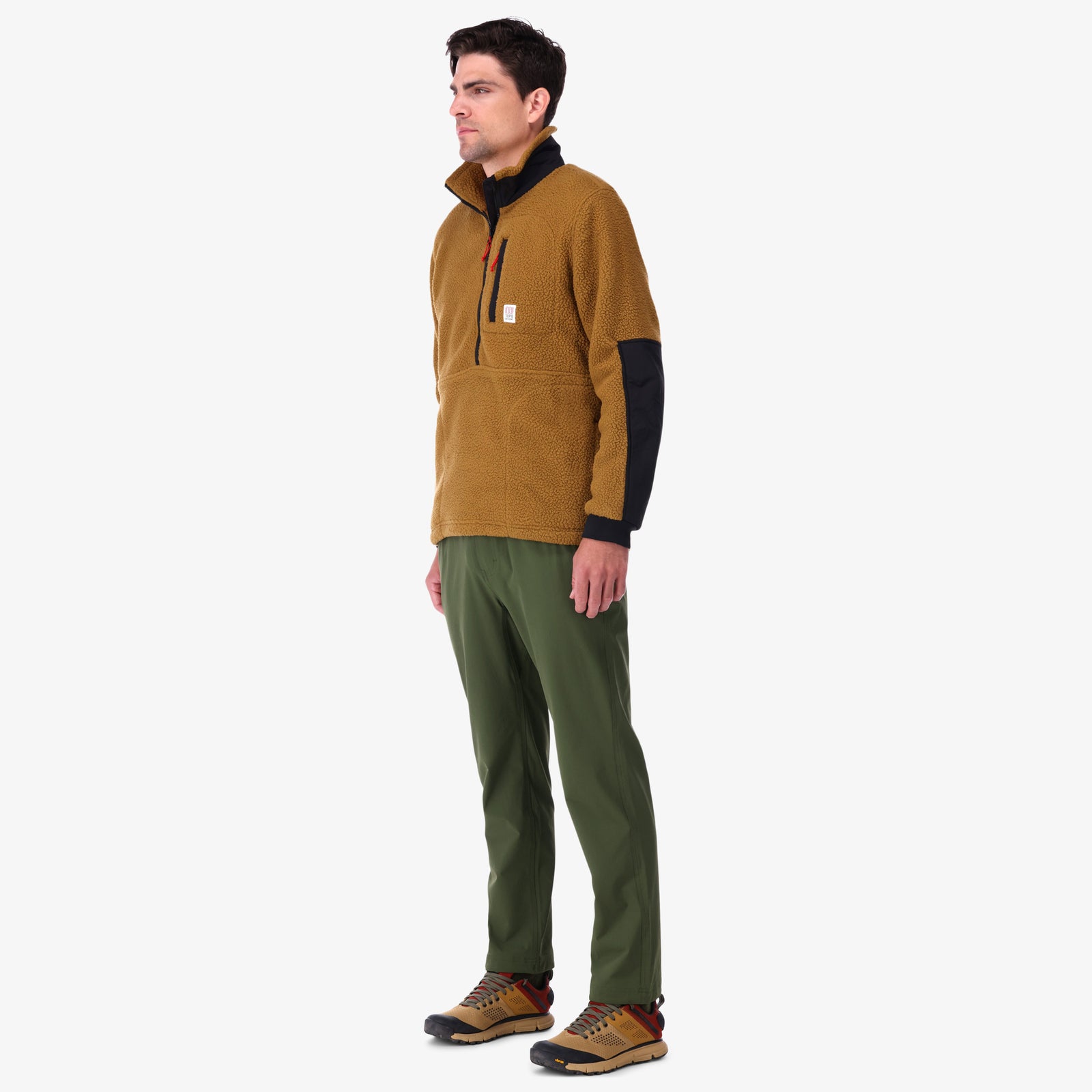 Topo Designs Men's Mountain Fleece Pullover in "dark khaki / black" brown on model.
