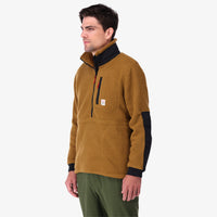 Topo Designs Men's Mountain Fleece Pullover in "dark khaki / black" brown on model.