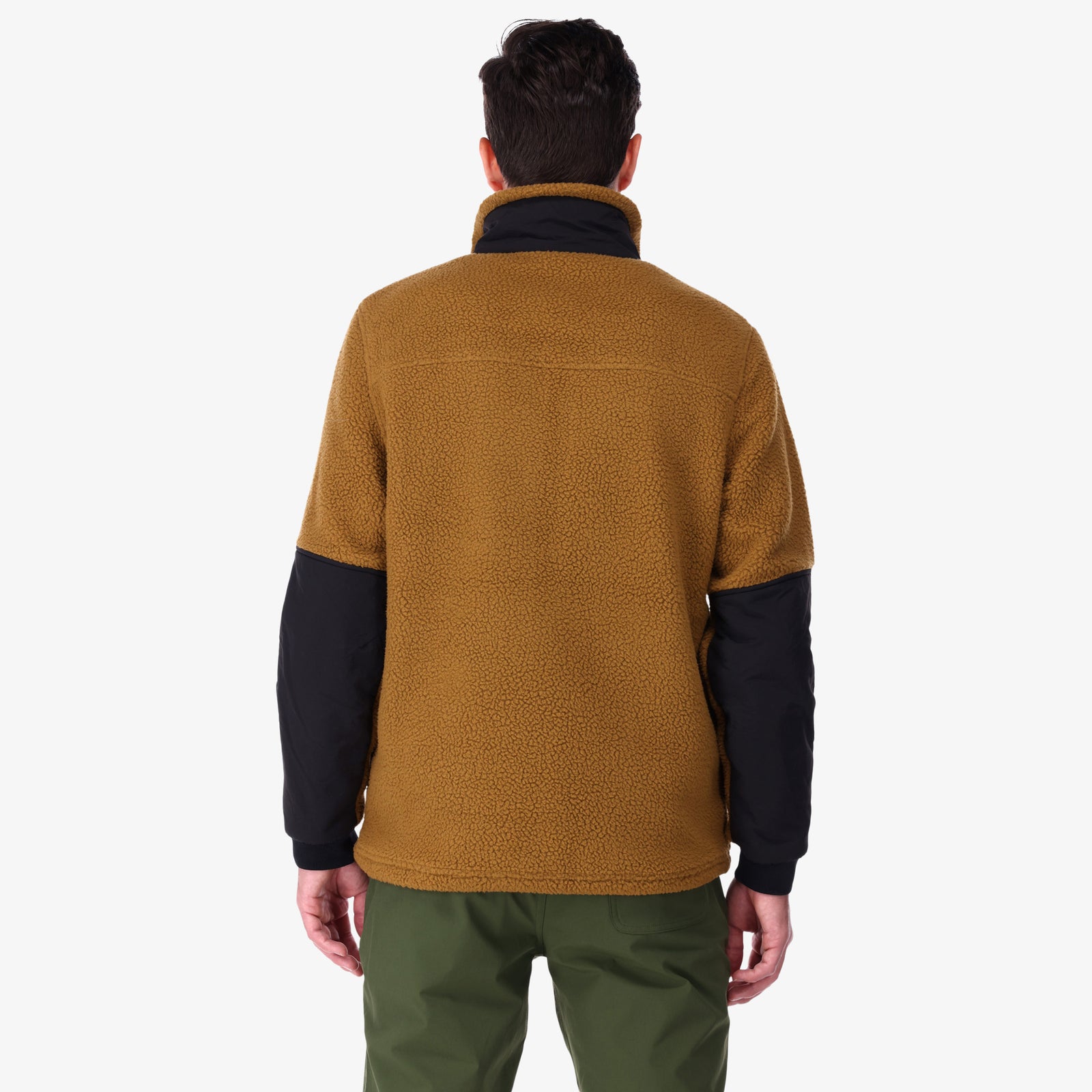 Back of Topo Designs Men's Mountain Fleece Pullover in "dark khaki / black" brown on model.
