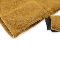 Detail shot of Topo Designs Men's Mountain Fleece Pullover in "dark khaki" brown showing cuff and hand pocket.