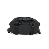 General shot of bottom compression straps on Topo Designs Mountain Hip Pack lumbar bum bag in Black.
