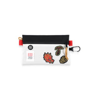 Topo Designs x Stance Accessory Bag with mushroom, wildflower, and pinecone patches and carabiner clip