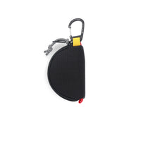 General shot of back of Topo Designs Taco Bag carabiner key clip keychain bag in black recycled nylon.