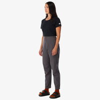 Topo Designs Women's Lightweight Tech Pants in "charcoal" gray on model front.