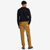 Back model shot of Topo Designs Men's Boulder lightweight climbing & hiking pants in "dark khaki" brown. Show on "Pond Blue" "Black" & "Charcoal"