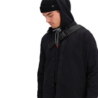 Front model shot of Topo Designs Men's Dirt Shirt long sleeve organic cotton button-up in "black"