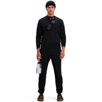 Front model shot of Topo Designs Men's Dirt Crew sweatshirt in 100% organic cotton in "black"