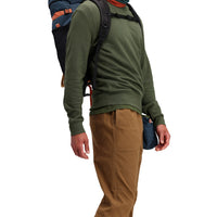 Front model shot of Topo Designs Men's Dirt Crew sweatshirt in 100% organic cotton in "olive" green