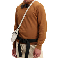 Front model shot of Topo Designs Men's Dirt Crew sweatshirt in 100% organic cotton in "earth" brown