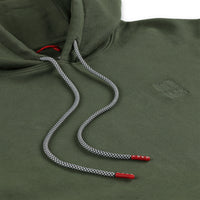 Detail shot of custom drawstrings & embroidered  chest logo on Topo Designs Men's Dirt Hoodie 100% organic cotton French terry sweatshirt in "olive" green.
