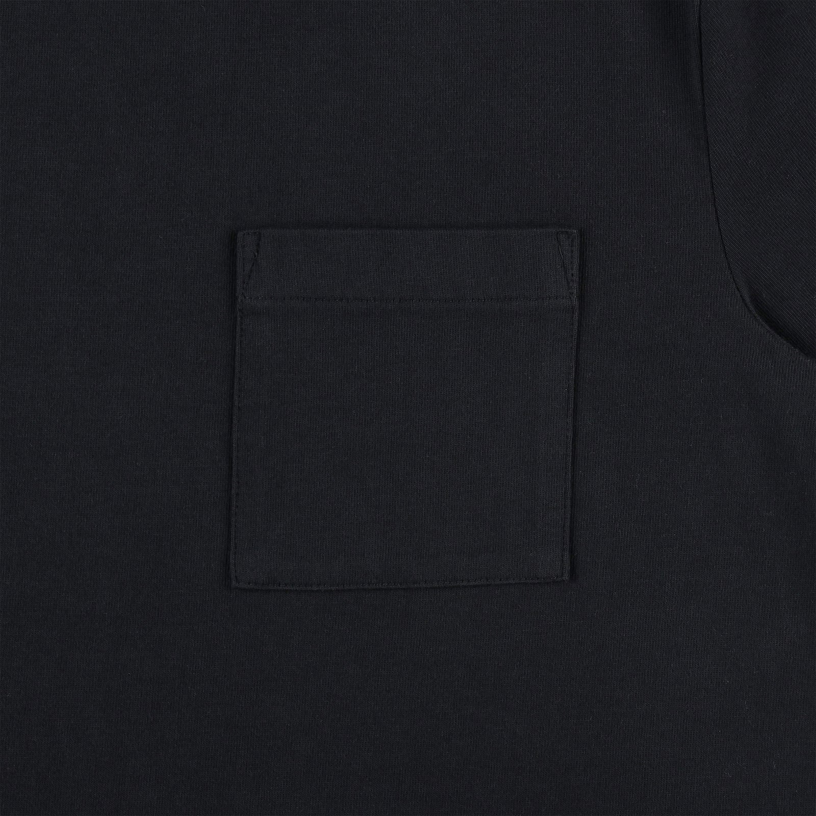 General detail shot of chest pocket on Topo Designs Men's Dirt Pocket Tee 100% organic cotton short sleeve t-shirt in "black"