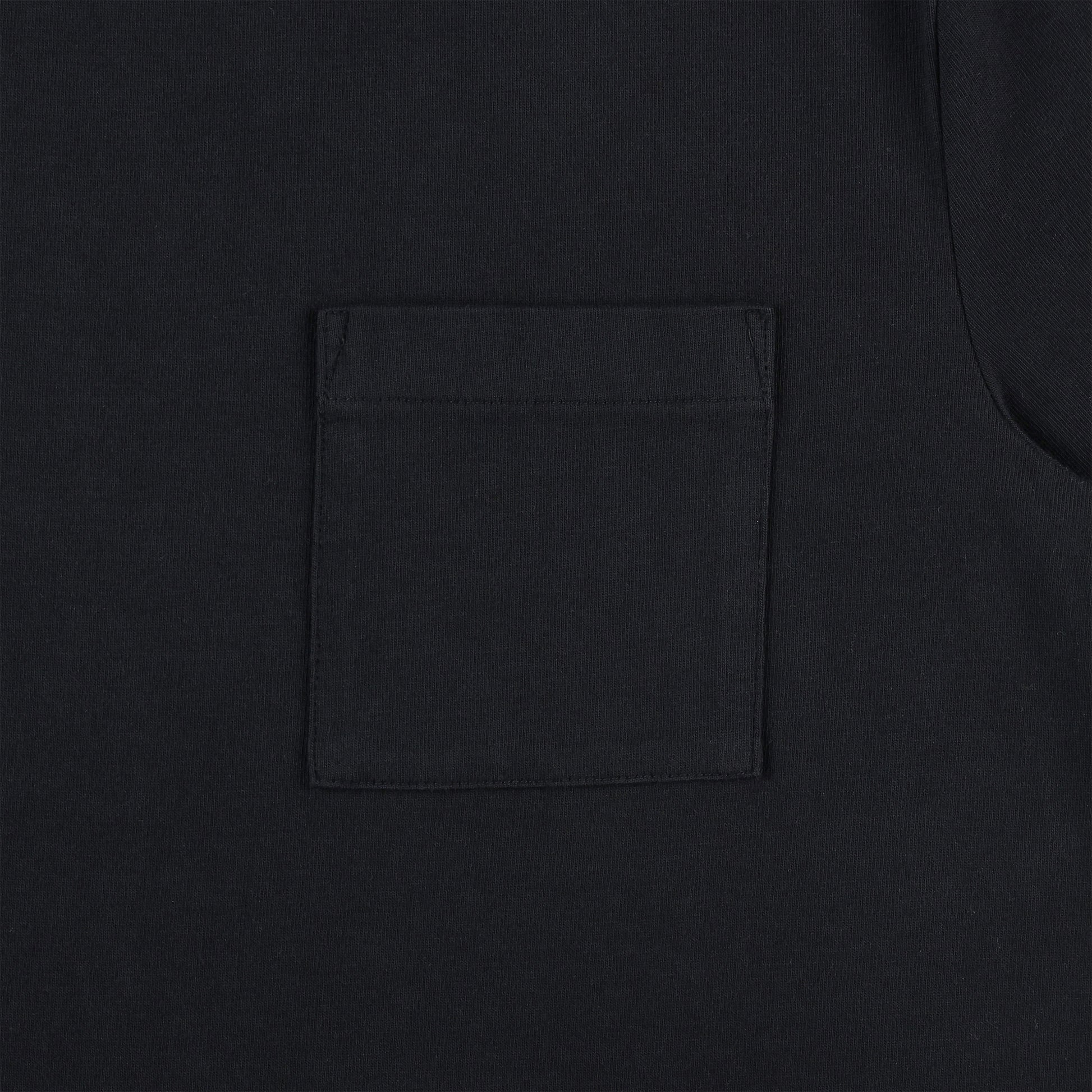 General detail shot of chest pocket on Topo Designs Men's Dirt Pocket Tee 100% organic cotton short sleeve t-shirt in "black"