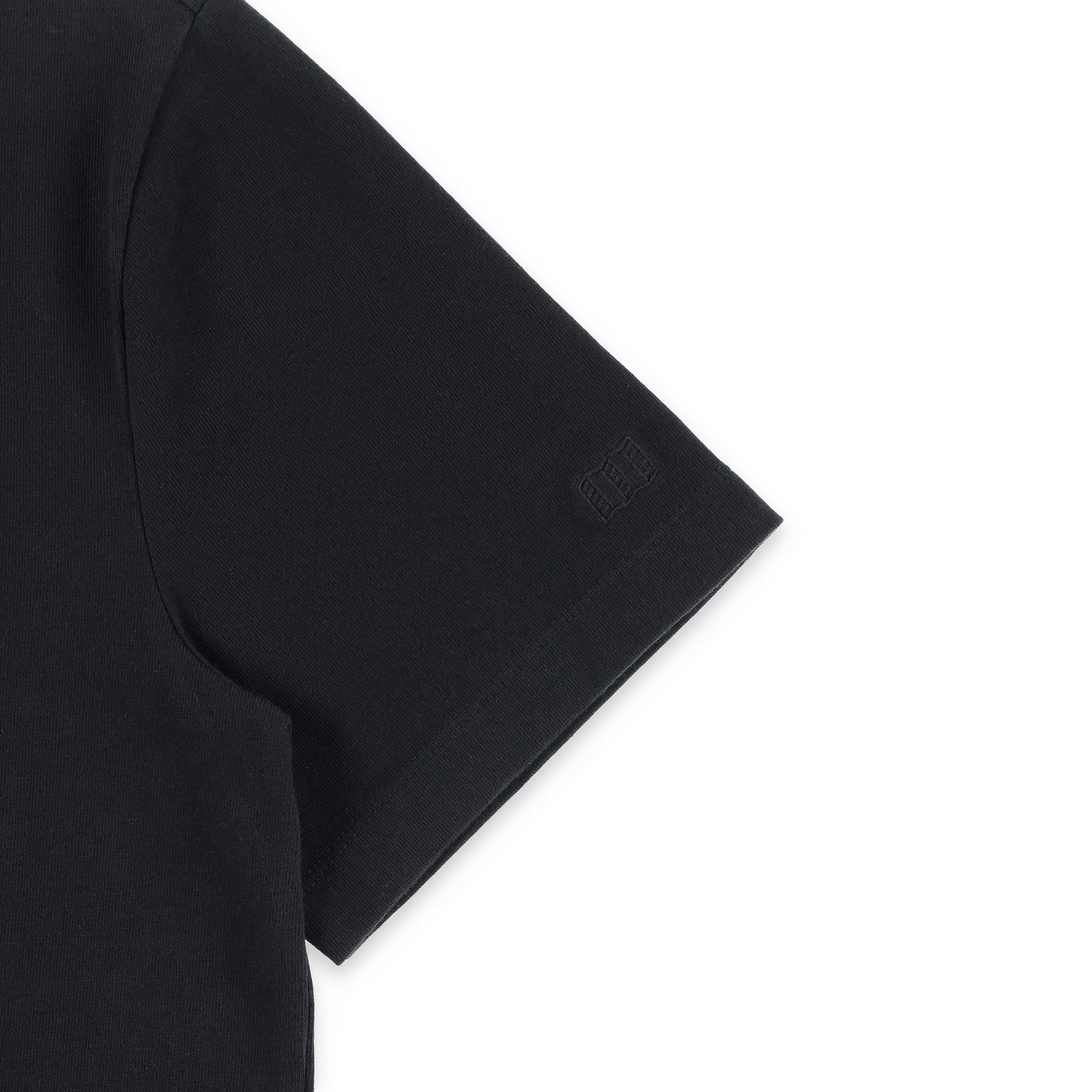 General detail shot of embroidered map logo on sleeve of Topo Designs Men's Dirt Pocket Tee 100% organic cotton short sleeve t-shirt in "black"