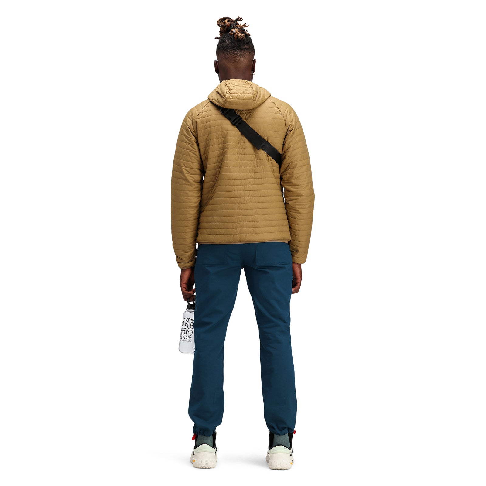 Back model shot of Topo Designs Men's Global Puffer packable recycled insulated Hoodie jacket in "dark khaki" brown